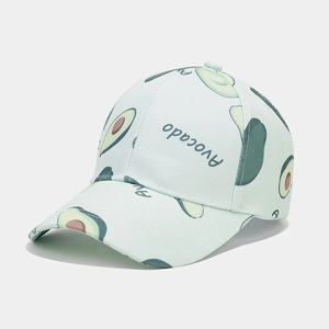 Detail of baseball cap showing cartoon avocado patterns and Avocado print text