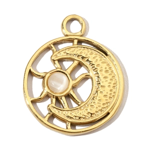 Close-up of a gold celestial pendant with a white gemstone and sun moon engraving