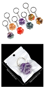 Detailed size view of cat paw crystal keychains in various colors with packaging
