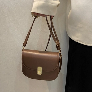 Retro dark brown saddle bag with metal clasp and adjustable strap for women