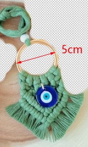 Green handmade cotton evil eye pendant with 5cm gold ring and tassel decoration