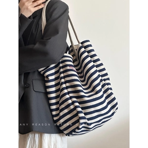 Women stripe canvas tote bag with navy blue stripes and red embroidery on shoulder