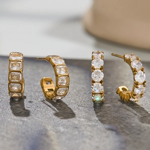 Macro shot of 18k gold plated stainless steel C-shape earrings with zircon inlay