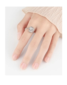 Close-up of model wearing silver spinning star and moon ring with clear cubic zirconia