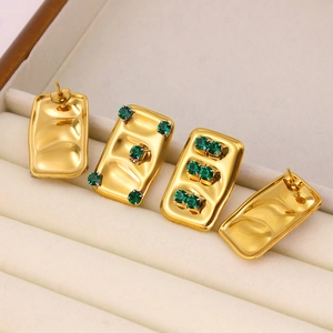 French vintage 18K gold plated square earrings with green zircon in a jewelry box