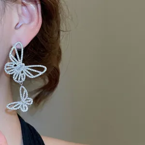 Sparkling zircon hollow butterfly asymmetric earrings with silver pins for women