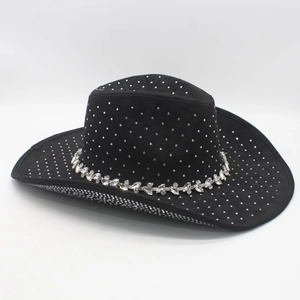 Close-up of black cowboy hat featuring silver studs and sparkling rhinestone band detail