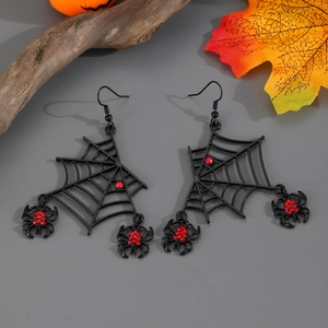 Detail of gothic spider web earrings with red rhinestones and hanging spider charms