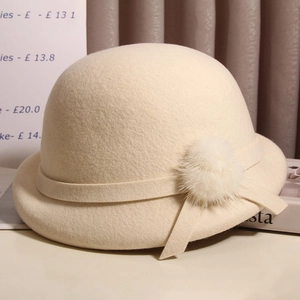 Elegant wool felt beret for women with a plush fur pompom and stylish ribbon trim