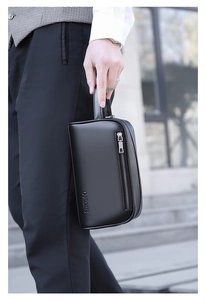 Men's business clutch bag in black lychee leather with wrist strap and zipper details
