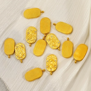 Golden zodiac tarot charms on silk fabric featuring Leo and Sagittarius embossed relief