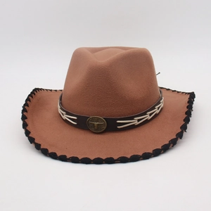 Close-up of brown felt western hat with faux leather band and metallic ox head emblem