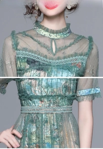 Detailed view of the mesh dress featuring floral embroidery and chic pleated collar