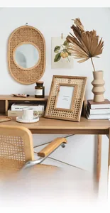 Detail showing natural handmade rattan picture frame and woven wall mirror on desk