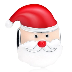 Macro detail of Santa Claus bead charm with red enamel finish and silver plating