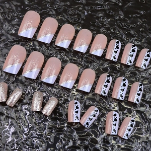French tip press-on nails with blue glitter hearts and pink medium long coffin design