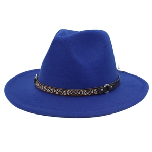Close-up of royal blue fedora hat with ethnic patterned band and silver metal ring buckle