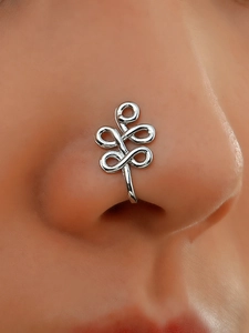 Macro view of silver U-shaped non-pierced nose clip with woven geometric metal pattern