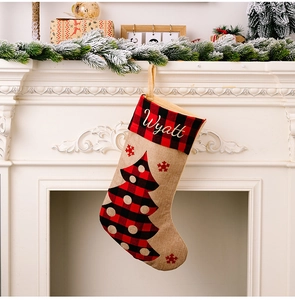 Personalized red and black plaid burlap Christmas stocking with Wyatt name embroidery