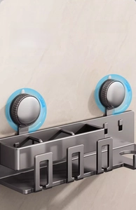 Detail view of dark grey suction cup shelf showing easy rotating installation and metal finish