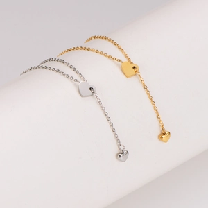 Minimalistische Edelstahl-Halskette mit Herzanhänger und Quasten in Gold und Silber