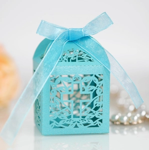 Laser cut hollow light blue favor box with cross design and silk ribbon detail