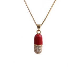 Gold box chain necklace with red enamel capsule pendant featuring micro-paved zircons