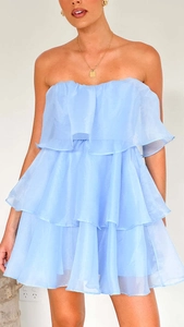 Detail of light blue strapless tiered ruffle dress made of layered organza fabric