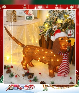 Close-up of lighted Dachshund Christmas decoration with striped scarf and LED warm lights