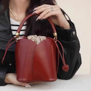Elegant red tulip petal bucket bag with heart drawstring and top handle for women