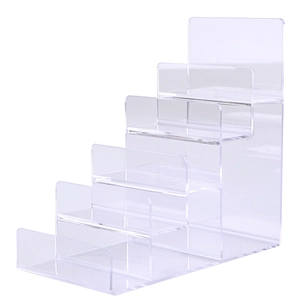 Five-tier clear acrylic display stand with tiered ladder design for wallets and cosmetics