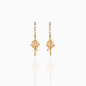 Close-up of pink lollipop earrings in 18K gold plating with sparkling zircon stones
