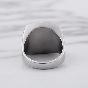 Macro detail of men's titanium steel ring showing inner surface and brushed texture