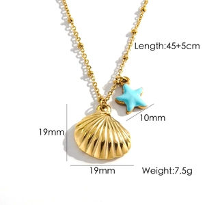Golden stainless steel necklace with shell and starfish pendant on white background