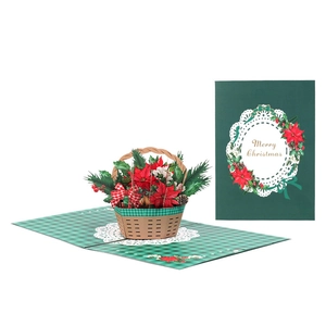 3D pop up Christmas card featuring a poinsettia flower basket with a Merry Christmas message