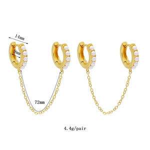 Detail view of 18K gold tassel earrings with 14mm hoops and a 72mm connecting chain