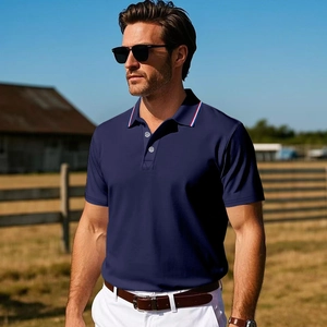 Detailed view of the navy polo shirt collar featuring red white and blue striped accents