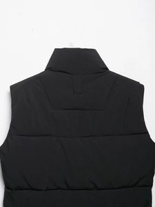 Close-up of black padded vest featuring a stand-up collar and horizontal quilting detail