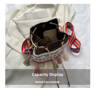 Internal view of bohemian drawstring bucket bag showing storage space and colorful tassels