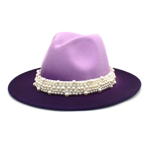 Detail of lavender fedora hat showing gradient wool felt and pearl embellishment