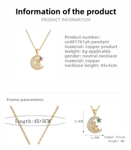 Detail of gold moon bear pendant with white and red star-shaped zircon stones