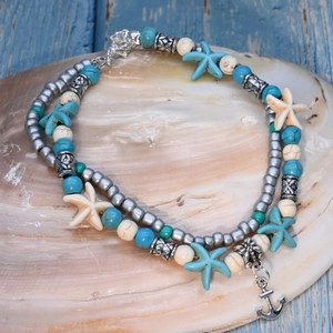 Detail of double-layer ocean anklet with turquoise beads, starfish and anchor charms