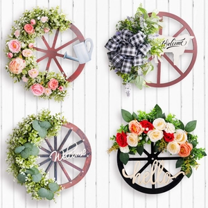 Set of four rustic farmhouse wooden wagon wheel wreaths with floral decor and welcome signs