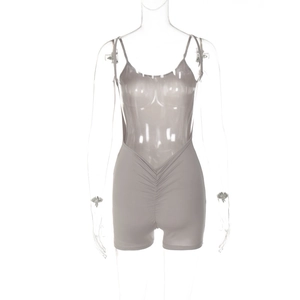 Detail of grey sleeveless jumpsuit featuring slim fit ruched waist and spaghetti straps