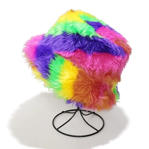 Close-up of rainbow faux fur bucket hat showing colorful plush texture and thick material