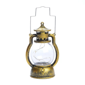 Retro bronze LED lantern decorative light with intricate fairy lights on white background