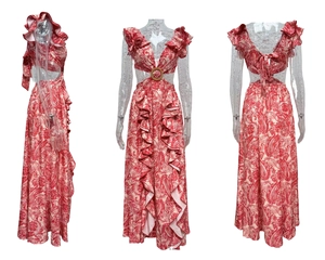 Detail of floral pink dress featuring waist cut-out with decorative gold metal ring connector