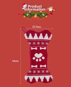 Detail of knit bone-shaped Christmas stocking with snowflake patterns and 44x23.5cm size
