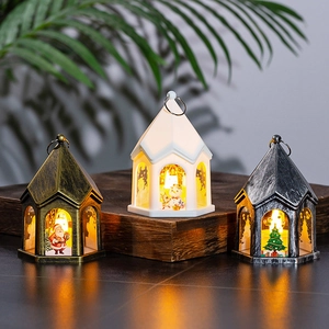 Close-up of vintage Christmas lanterns with Santa and snowman motifs in warm LED glow