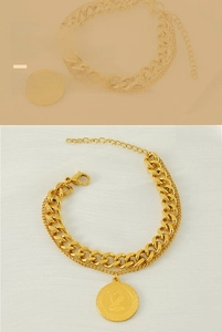 Detail of a double-layered gold bracelet with a Cuban chain and a vintage coin pendant